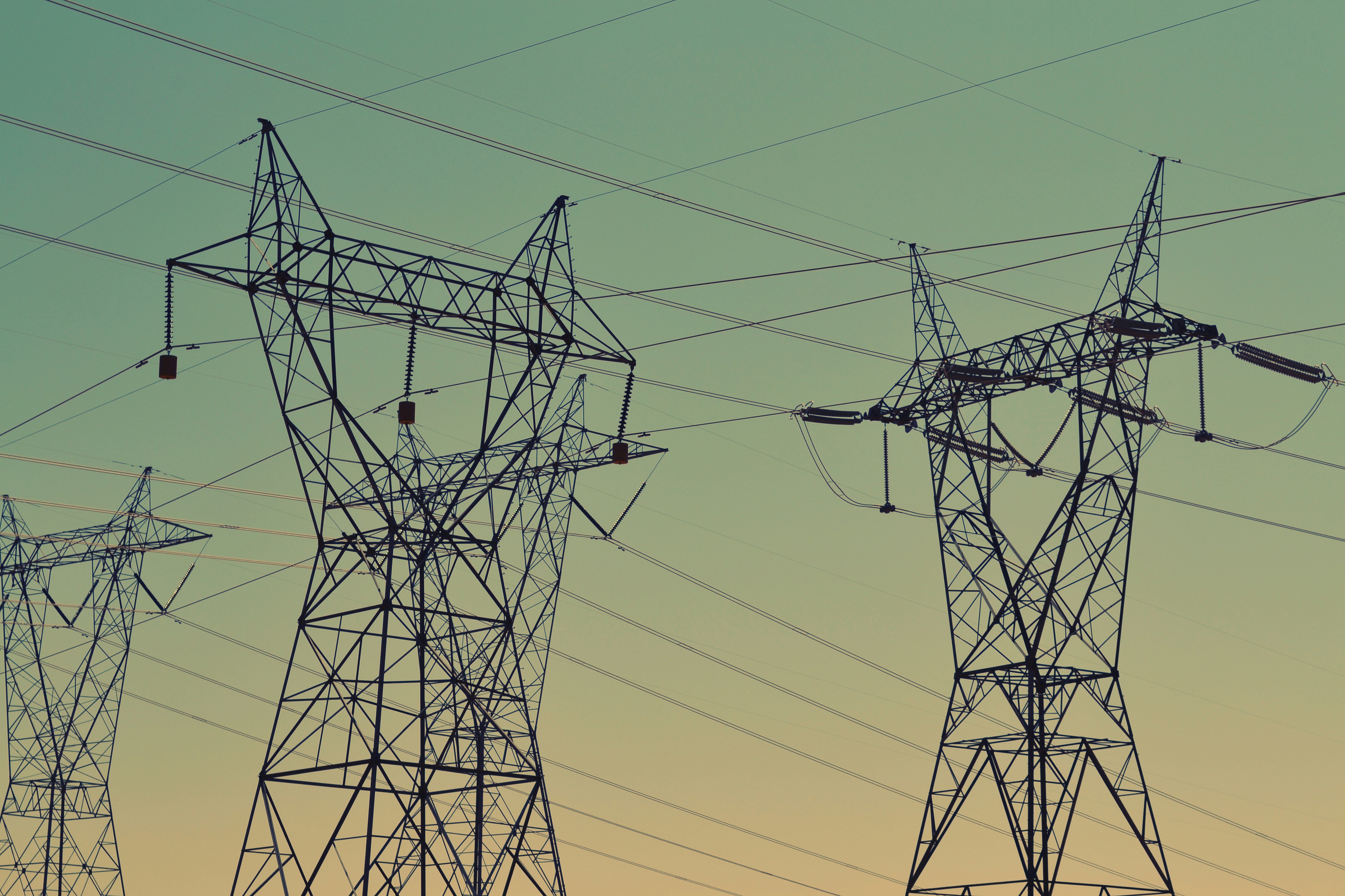 High-voltage electricity transmission towers supporting power distribution